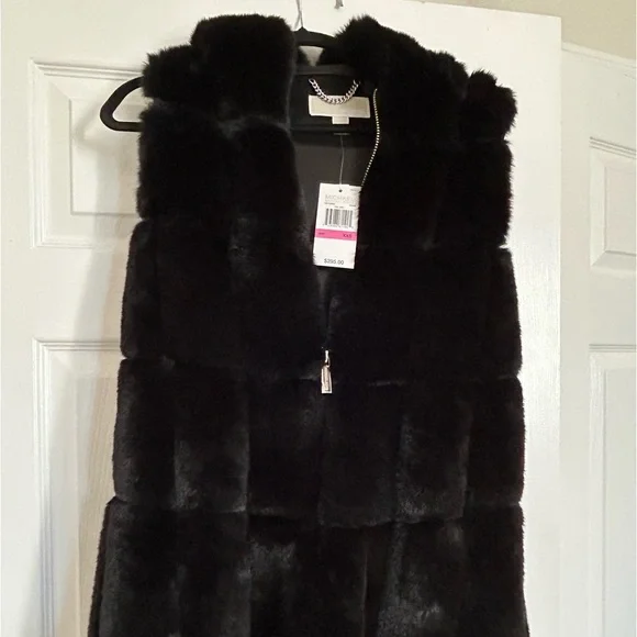 Beautiful NEW black faux fur Michael Kors Vest.Sized XXS, fits like a small.